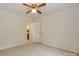 Bright bedroom featuring neutral walls, carpet, ceiling fan, and ensuite bathroom at 8709 Stratton Farm Rd, Huntersville, NC 28078