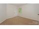Bedroom featuring carpet floor, window with green view, and neutral walls at 8709 Stratton Farm Rd, Huntersville, NC 28078