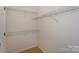 Walk-in closet featuring white walls and wire shelving for optimal storage at 8709 Stratton Farm Rd, Huntersville, NC 28078