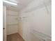 Walk-in closet features carpet floor and multiple wire rack shelves for ample storage at 8709 Stratton Farm Rd, Huntersville, NC 28078