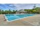 Community pool with a large pool, seating area, and lifeguard at 8709 Stratton Farm Rd, Huntersville, NC 28078