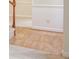 Hallway featuring hardwood floors transitioning to carpet, with white trim and wainscoting at 8709 Stratton Farm Rd, Huntersville, NC 28078