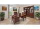 Cozy home office featuring a wooden desk, bookcase, and plush rug, perfect for remote work at 8709 Stratton Farm Rd, Huntersville, NC 28078