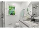 Bright bathroom featuring granite countertop, black hardware, and a window with a view at 910 Lightwood Dr, Matthews, NC 28105
