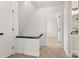 Upstairs hallway with carpet and white walls at 910 Lightwood Dr, Matthews, NC 28105