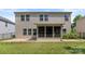 Backyard view of a home with a patio, fenced yard and a screened-in porch at 9849 Steele Meadow Rd, Charlotte, NC 28273
