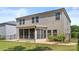 Two-story home features a backyard with a patio and enclosed sunroom at 9849 Steele Meadow Rd, Charlotte, NC 28273