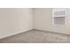 Bedroom with plush carpeting and window, offers a serene retreat at 9849 Steele Meadow Rd, Charlotte, NC 28273