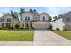 Charming two-story home with a manicured lawn and a two-car garage at 9849 Steele Meadow Rd, Charlotte, NC 28273