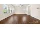 Spacious living room with hardwood floors and plenty of natural light at 9849 Steele Meadow Rd, Charlotte, NC 28273