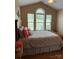 Serene bedroom with large windows, vaulted ceilings, and hardwood flooring at 1025 Bee Line Ln, Salisbury, NC 28147