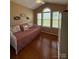 Comfortable bedroom with ample natural light, hardwood floors, and vaulted ceiling at 1025 Bee Line Ln, Salisbury, NC 28147