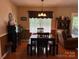 Cozy dining room features natural light, stylish furnishings, and hardwood flooring at 1025 Bee Line Ln, Salisbury, NC 28147