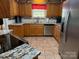 Well-equipped kitchen with granite countertops, stainless steel appliances, and tile flooring at 1025 Bee Line Ln, Salisbury, NC 28147