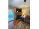 Cozy living room area with a fireplace and access to a slider to outside at 1025 Bee Line Ln, Salisbury, NC 28147