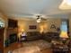 Comfortable living room boasts a fireplace, ceiling fan, and ample seating at 1025 Bee Line Ln, Salisbury, NC 28147