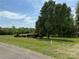 The lawn, mature trees, and buildings provide privacy on this expansive lot at 1025 Bee Line Ln, Salisbury, NC 28147
