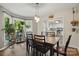 Sunlit dining room with bay window and view into the kitchen at 105 Horsestable Ct, Mooresville, NC 28115