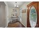 Welcoming foyer with hardwood floors and stylish decor accents at 105 Horsestable Ct, Mooresville, NC 28115