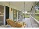 Cozy porch with rocking chairs and a swing, perfect for relaxing at 105 Horsestable Ct, Mooresville, NC 28115