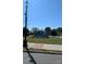 Mooresville community entrance sign with manicured lawn and clear blue skies at 105 Nighthawk Trl # 20, Mooresville, NC 28115