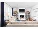 Comfortable living room featuring a fireplace, large windows with drapes, neutral furniture, and contemporary decor at 105 Nighthawk Trl # 20, Mooresville, NC 28115