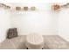 Spacious walk-in closet with shelving and an ottoman at 105 Nighthawk Trl # 20, Mooresville, NC 28115