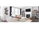 Bright living room with a fireplace, built-in shelving, modern decor, comfortable seating, and lots of natural light at 107 Nighthawk Trl # 21, Mooresville, NC 28115