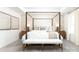 Serene main bedroom featuring a four-poster bed, neutral decor, plush carpeting, and soft, natural light at 107 Nighthawk Trl # 21, Mooresville, NC 28115