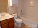 Bright bathroom featuring a vanity with sink and a toilet next to a shower and tub combo at 1156 Fowler Brook Ct, Indian Land, SC 29707