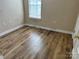 Bedroom featuring new flooring, a window for natural light, and outlets at 1156 Fowler Brook Ct, Indian Land, SC 29707