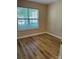 Bright bedroom featuring modern flooring and a window at 1156 Fowler Brook Ct, Indian Land, SC 29707