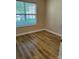 Bedroom featuring new flooring, a window for natural light, and fresh paint at 1156 Fowler Brook Ct, Indian Land, SC 29707