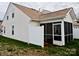 Back exterior view of house with a screened-in porch and fenced patio area at 1156 Fowler Brook Ct, Indian Land, SC 29707