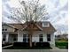 Inviting home with craftsman style windows and tan and white color scheme at 1156 Fowler Brook Ct, Indian Land, SC 29707