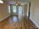Spacious living room with new wood flooring and plenty of natural light at 1156 Fowler Brook Ct, Indian Land, SC 29707