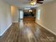 Open living room and kitchen layout with vinyl flooring and natural light at 1156 Fowler Brook Ct, Indian Land, SC 29707