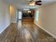 Open living room and kitchen layout with vinyl flooring and natural light at 1156 Fowler Brook Ct, Indian Land, SC 29707