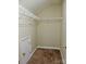 Carpeted walk-in closet featuring wire shelving and a small door on the left wall at 1156 Fowler Brook Ct, Indian Land, SC 29707