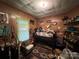 A compact bedroom, furnished with a lofted bed, an armchair, and shelves for storage and decoration at 1210 Congress St, Gastonia, NC 28054