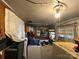 A small laundry room has wood paneling, a washer and dryer set, and an overhead light at 1210 Congress St, Gastonia, NC 28054