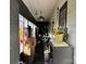 Outdoor porch showcases hanging curtains and foliage covered supports at 1210 Congress St, Gastonia, NC 28054