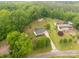 Aerial view of the property showcasing the house, mature trees, and expansive lot at 1215 Eastcreek Rd, Fort Lawn, SC 29714