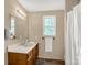 Simple bathroom with a vanity, mirror, towel rack, and shower at 1215 Eastcreek Rd, Fort Lawn, SC 29714
