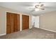 Bedroom with wall to wall carpeting and a closet with louvered doors at 1215 Eastcreek Rd, Fort Lawn, SC 29714