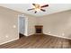 Bonus room with wood-look floors, fireplace, and an open door at 1215 Eastcreek Rd, Fort Lawn, SC 29714