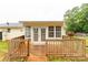 View of the house with a wooden deck and white doors and windows at 1215 Eastcreek Rd, Fort Lawn, SC 29714