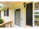 Close-up of the front door, shows exterior details, and adjacent window at 1215 Eastcreek Rd, Fort Lawn, SC 29714