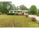 Charming single-story home with a covered front porch and a well-maintained front yard at 1215 Eastcreek Rd, Fort Lawn, SC 29714