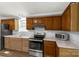 Classic kitchen with wood cabinets, stainless steel appliances, and a light-filled window at 1215 Eastcreek Rd, Fort Lawn, SC 29714